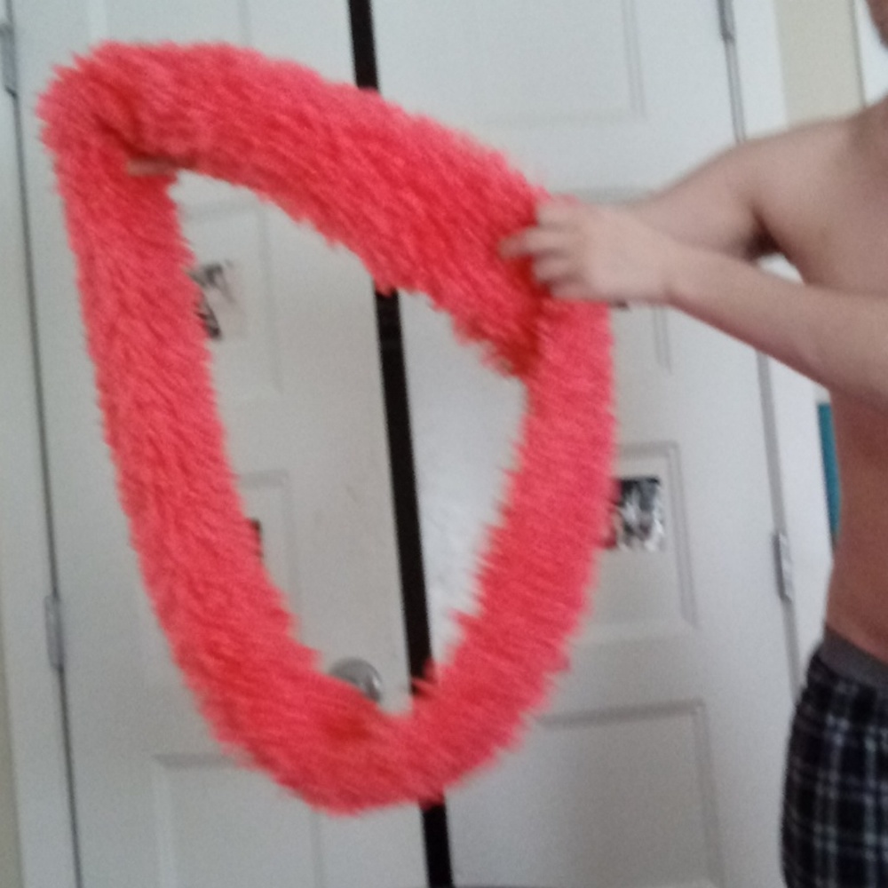 A pink fluffy scarf
